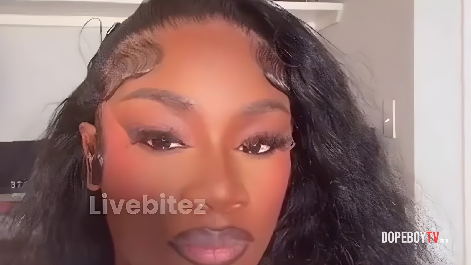 Fans Spot Papoose, Remy Ma & Daughter Portrait in Background of Claressa Shields Interview